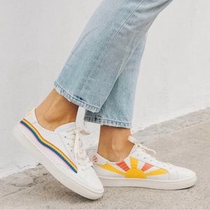 Soludos White Low-Top Sneakers with Rainbow Stripe and Yellow Sunburst